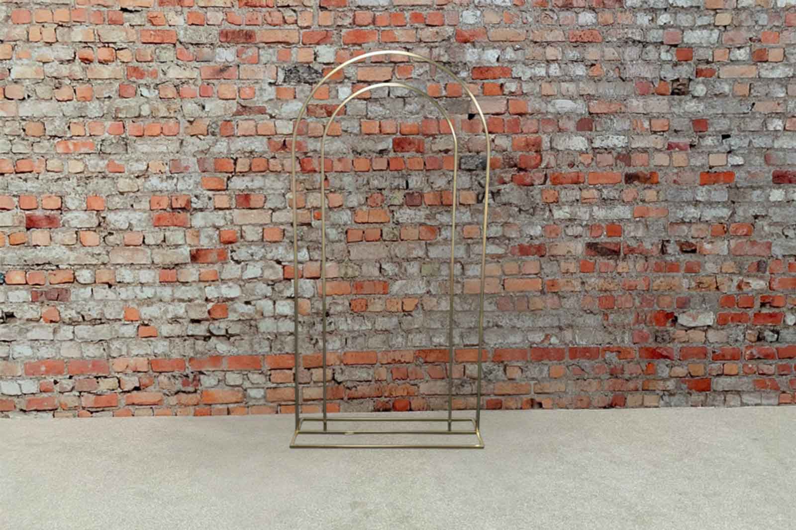 Gold archway backdrop creating a glamorous and elegant photo area for events