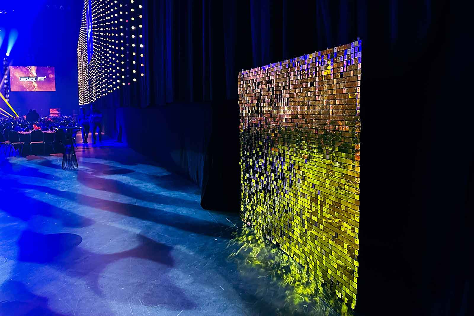 Gold shimmer wall backdrop for conference activations and corporate launches