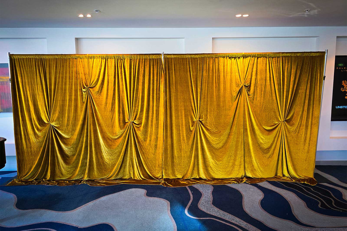 Gold velvet draping backdrop for elegant corporate events, weddings and special occasions in Auckland