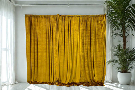 Gold velvet draping backdrop styled by Mad Dog Backdrops, featuring rich textured fabric for a luxe event look