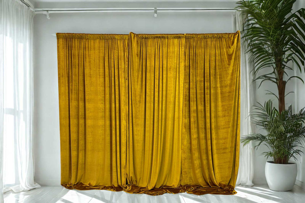 Gold velvet draping backdrop styled by Mad Dog Backdrops, featuring rich textured fabric for a luxe event look