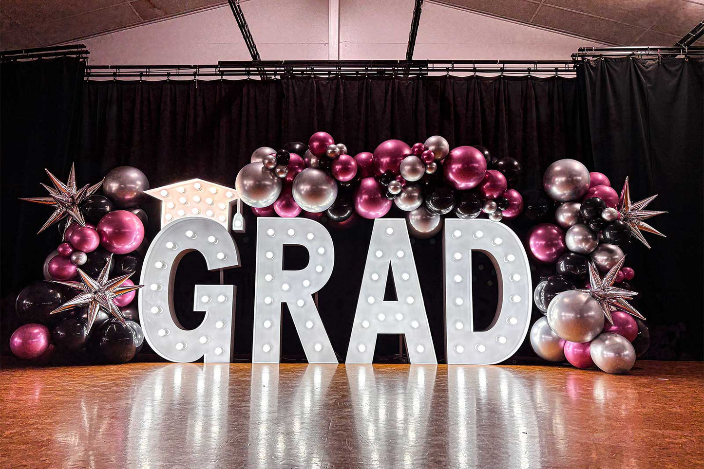 Graduation marquee light letters with balloon garland display for graduation celebration