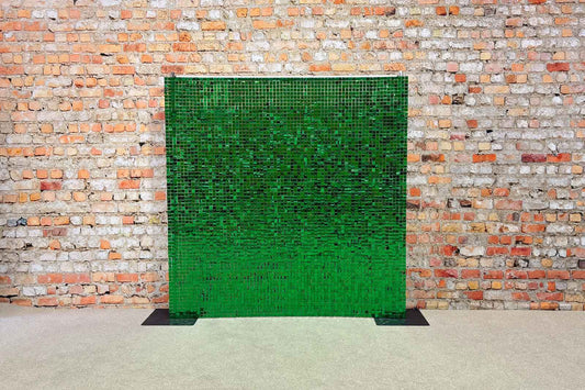 Green shimmer wall backdrop adding a glamorous touch to Christmas, tropical, weddings, parties, and themed events