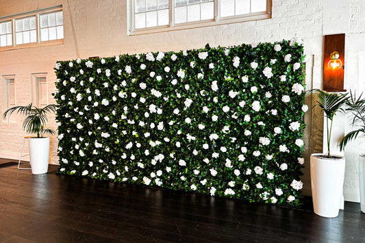 Green and white floral wall backdrop for product launches and corporate, baby shower parties.