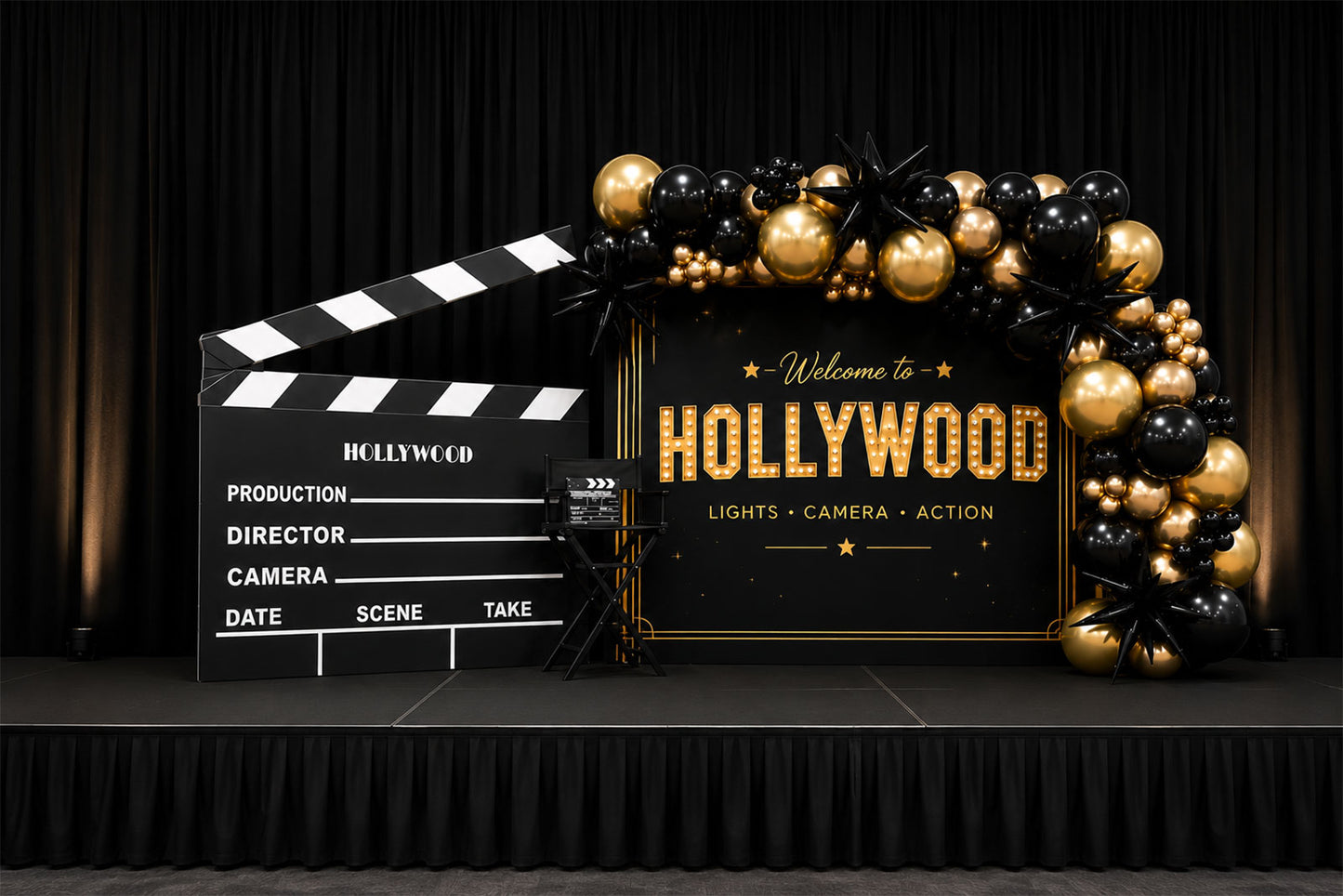 Luxury Hollywood backdrop with black and gold balloon garland, giant clapperboard prop and director's chair for corporate events, school balls and themed parties in Auckland