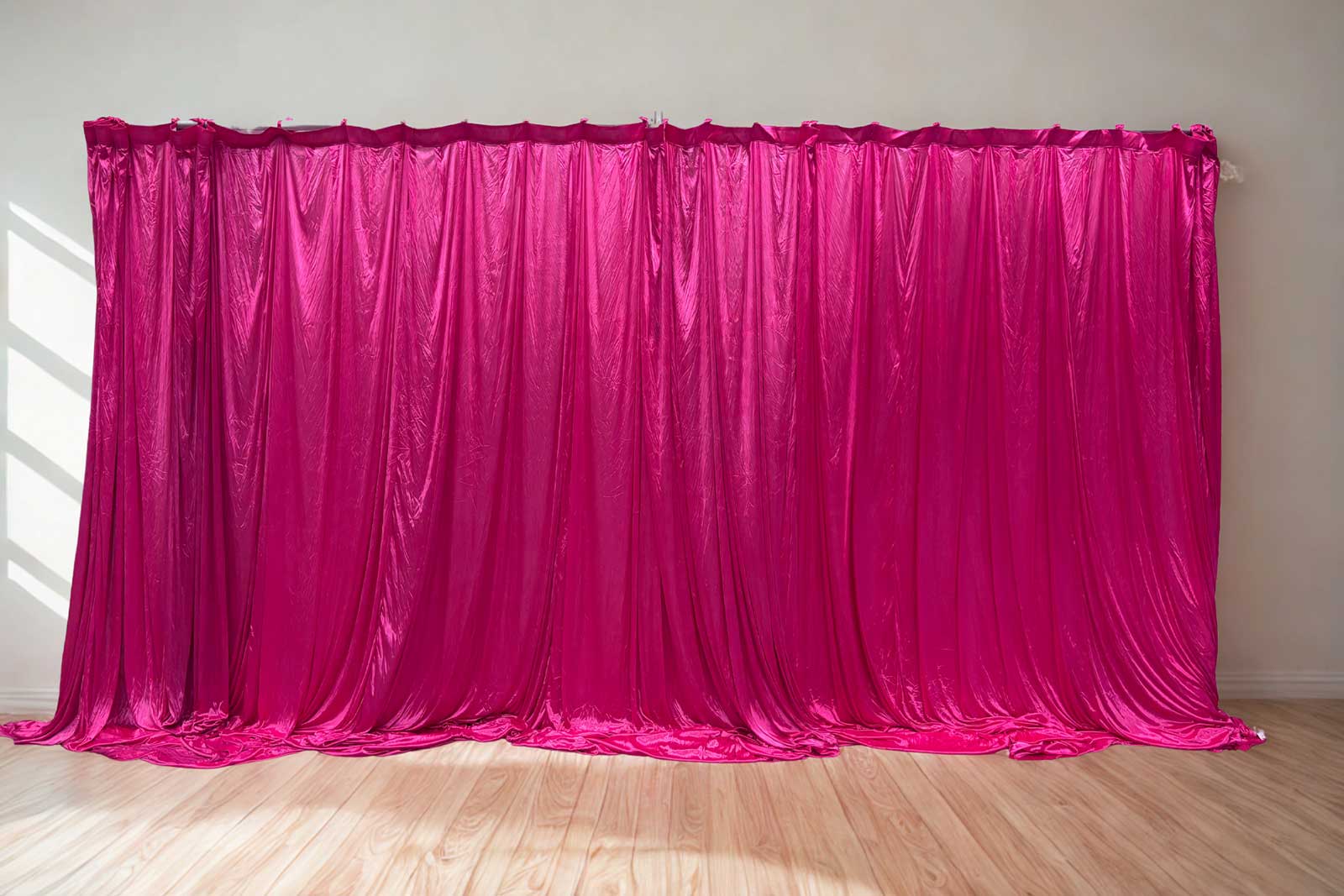 Hot pink backdrop curtain hire for vibrant parties, birthdays, and event décor