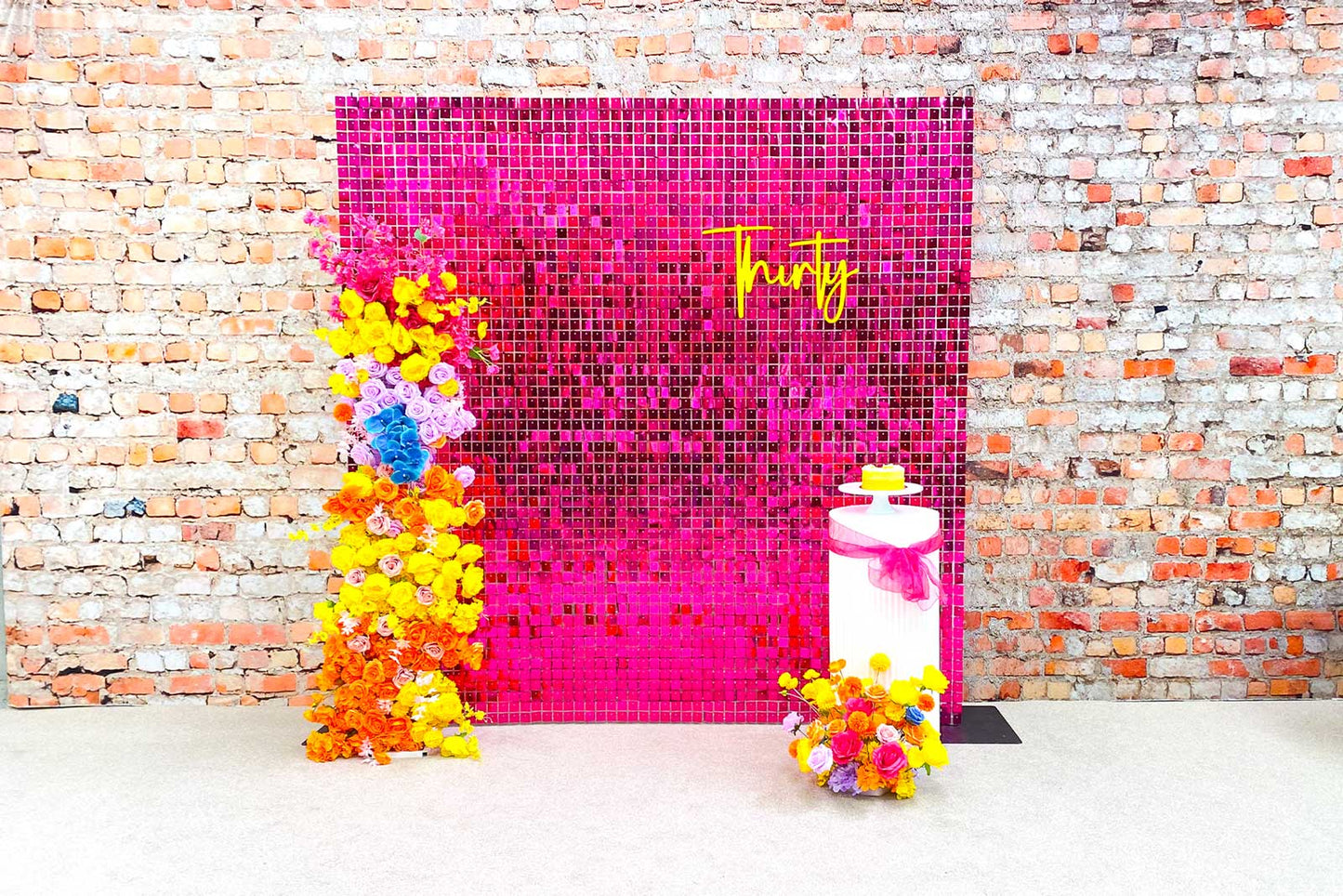 Hot pink shimmer wall backdrop for a fun and stylish 30th birthday celebration