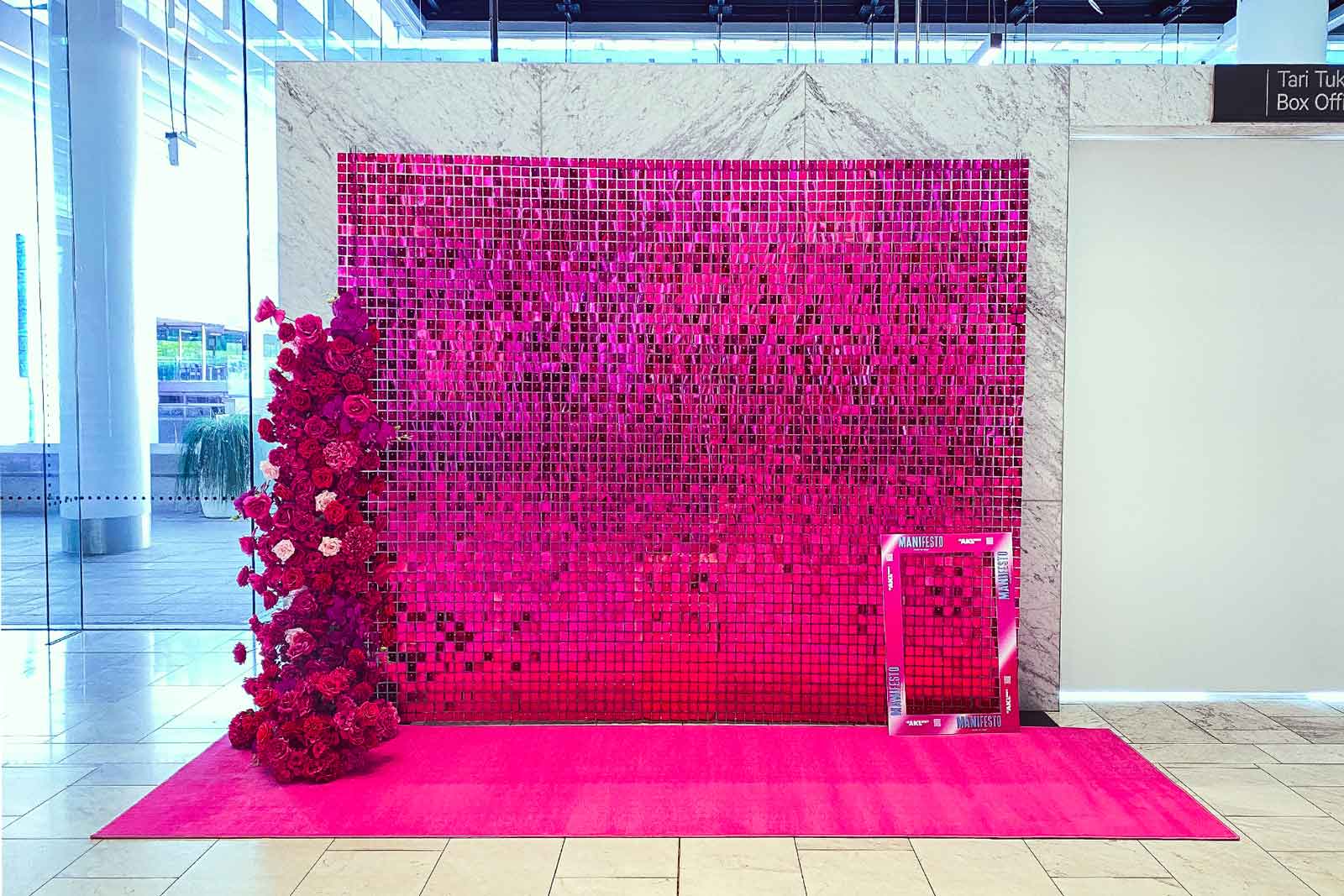 Hot pink shimmer wall backdrop creating a vibrant and professional look for corporate events