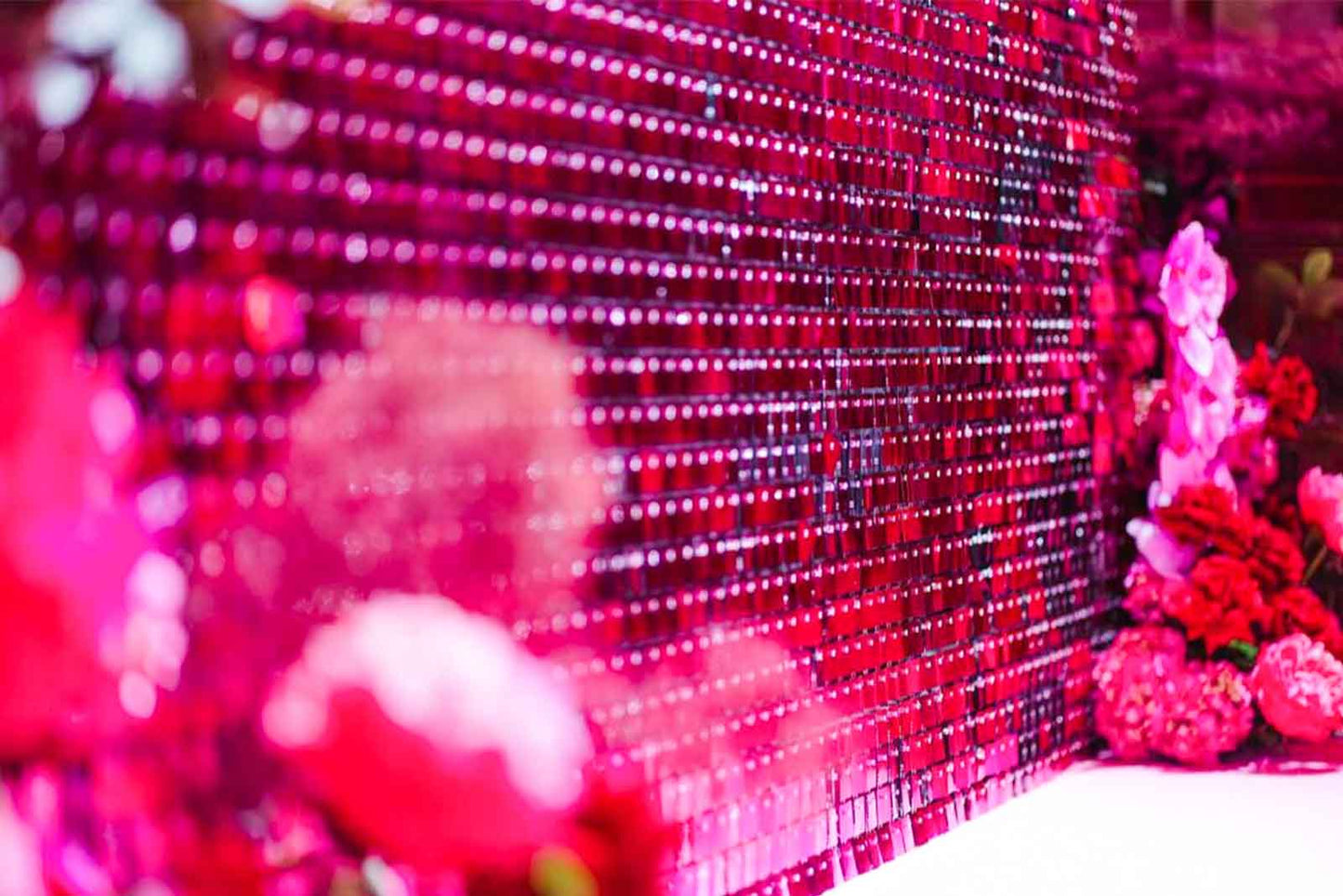 Vibrant hot pink shimmer wall for company launches, activations, and business functions