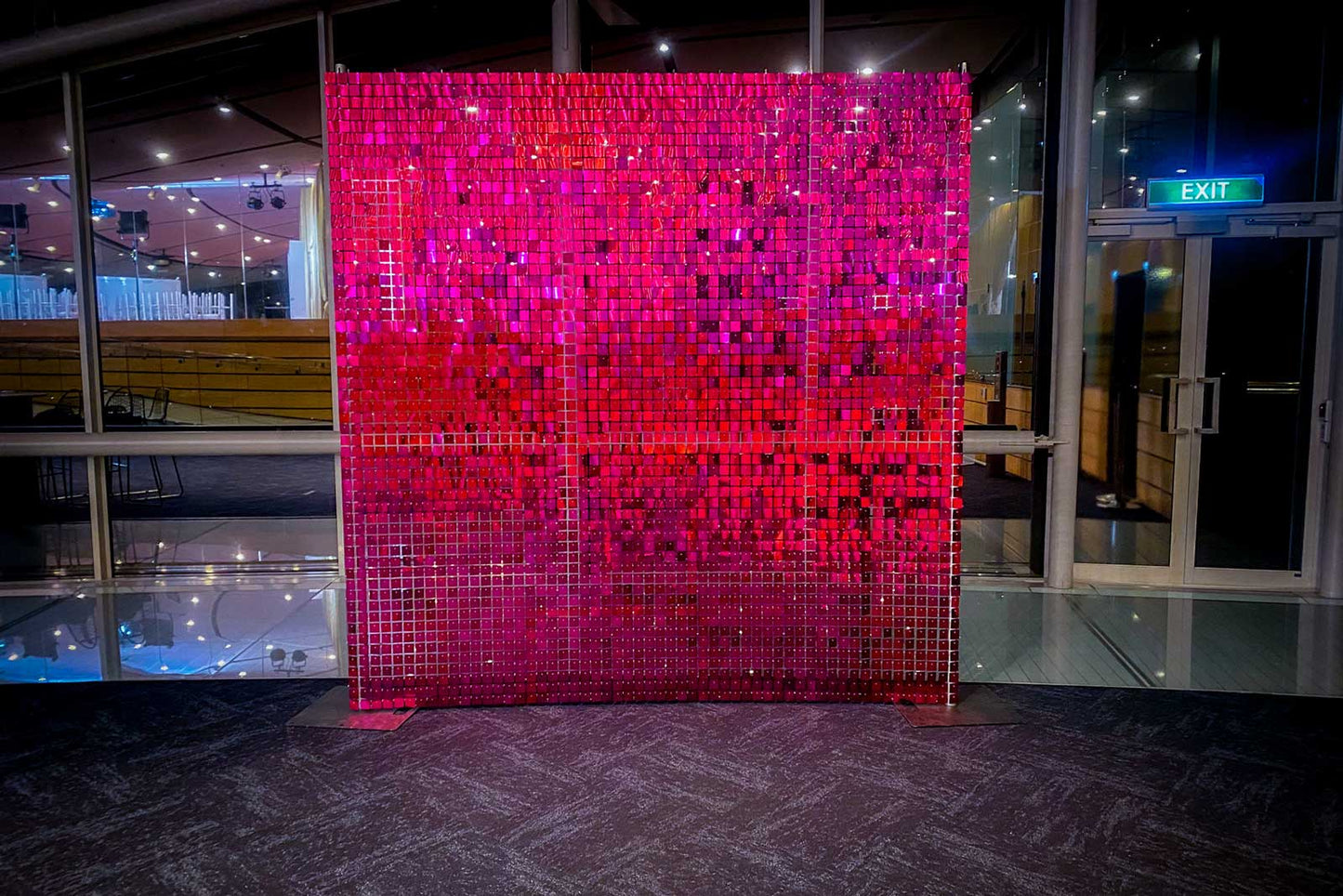 Hot pink shimmer wall backdrop for product launches, media walls, and corporate activations