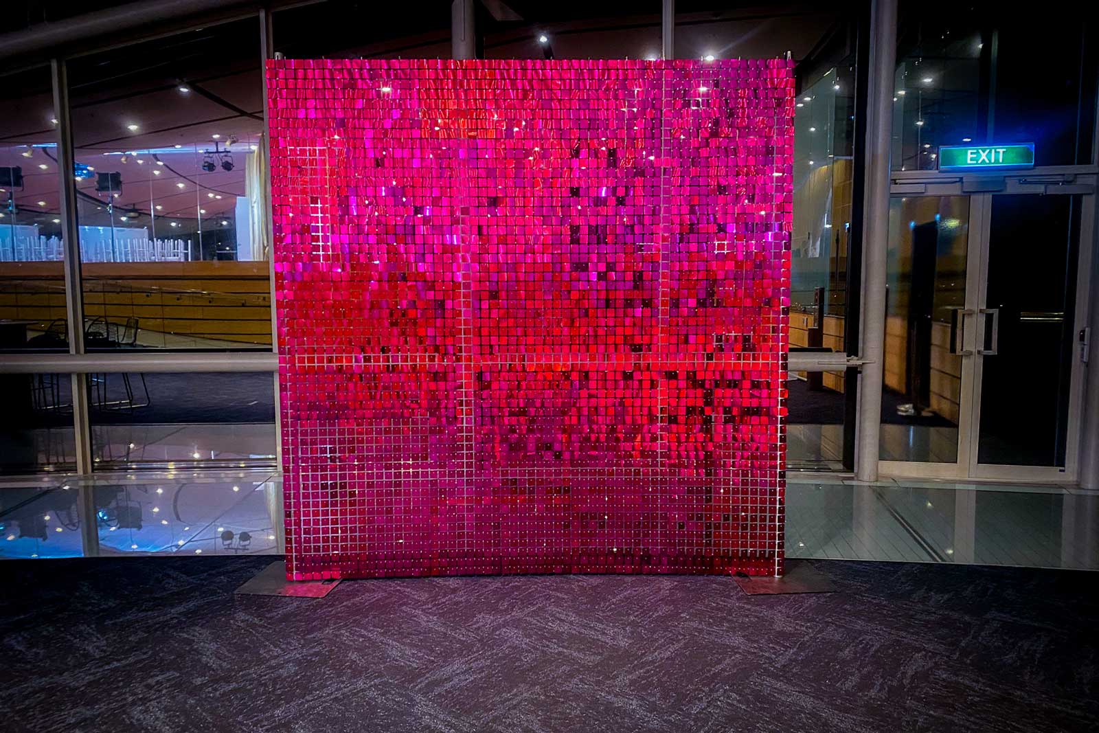 Hot pink shimmer wall backdrop for product launches, media walls, and corporate activations