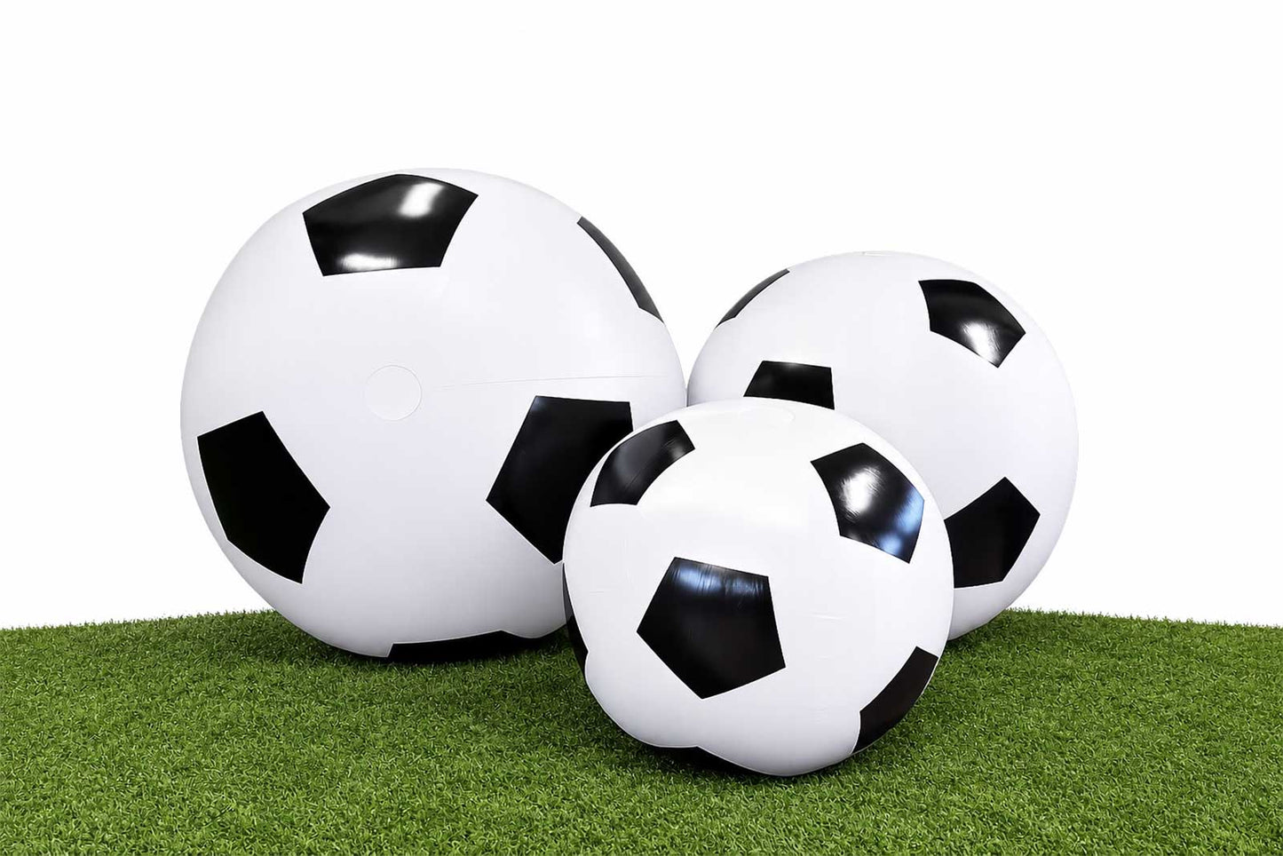 Inflatable soccer balls for hire in Auckland, perfect for soccer-themed birthday parties, football club events, sports days, school events, and World Cup celebrations.