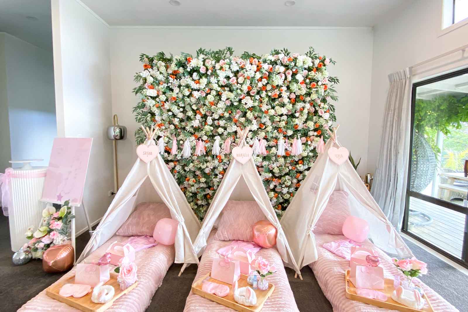 Bright and playful flower wall backdrop for children’s birthday party