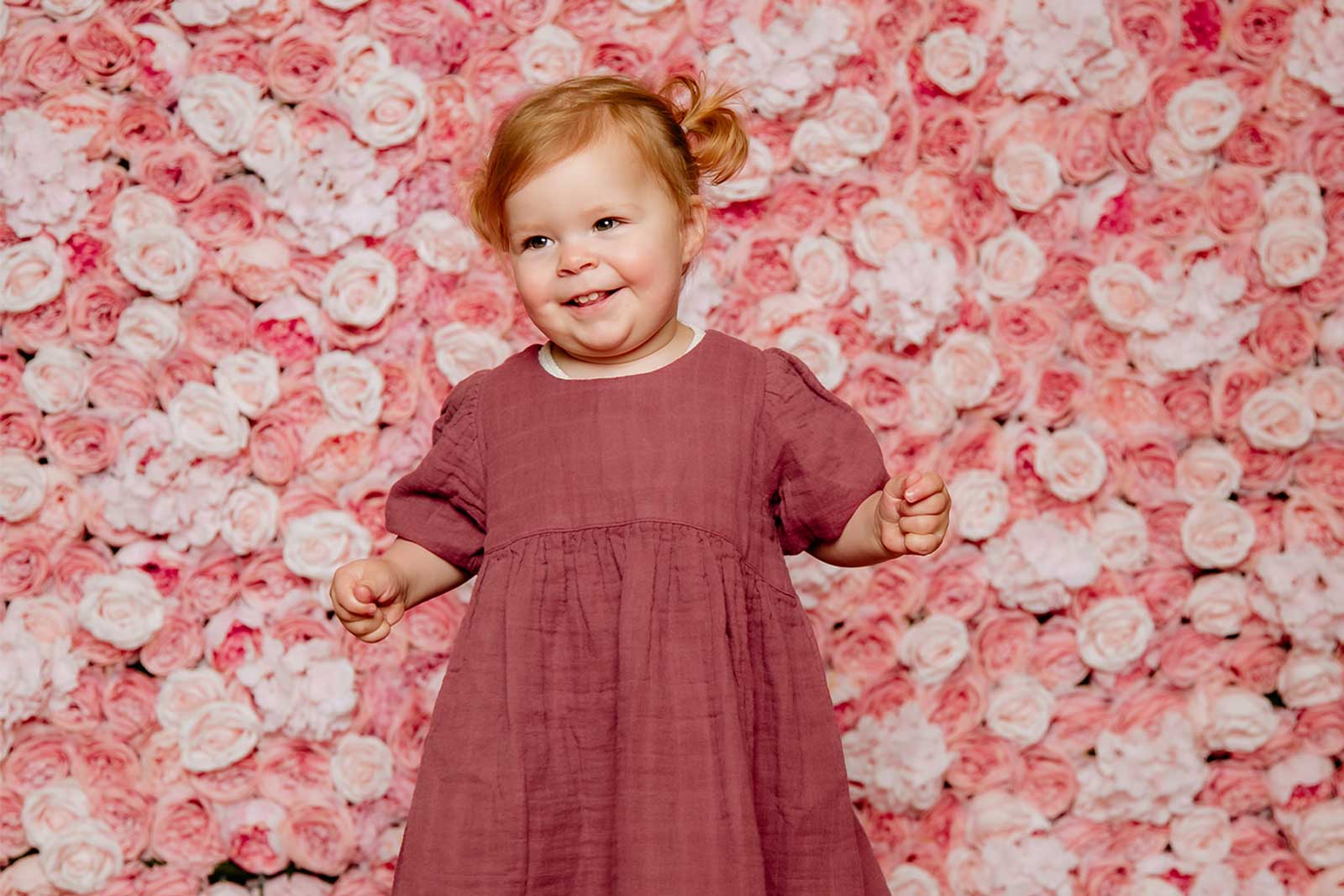 Vibrant flower wall backdrop for children’s birthday party