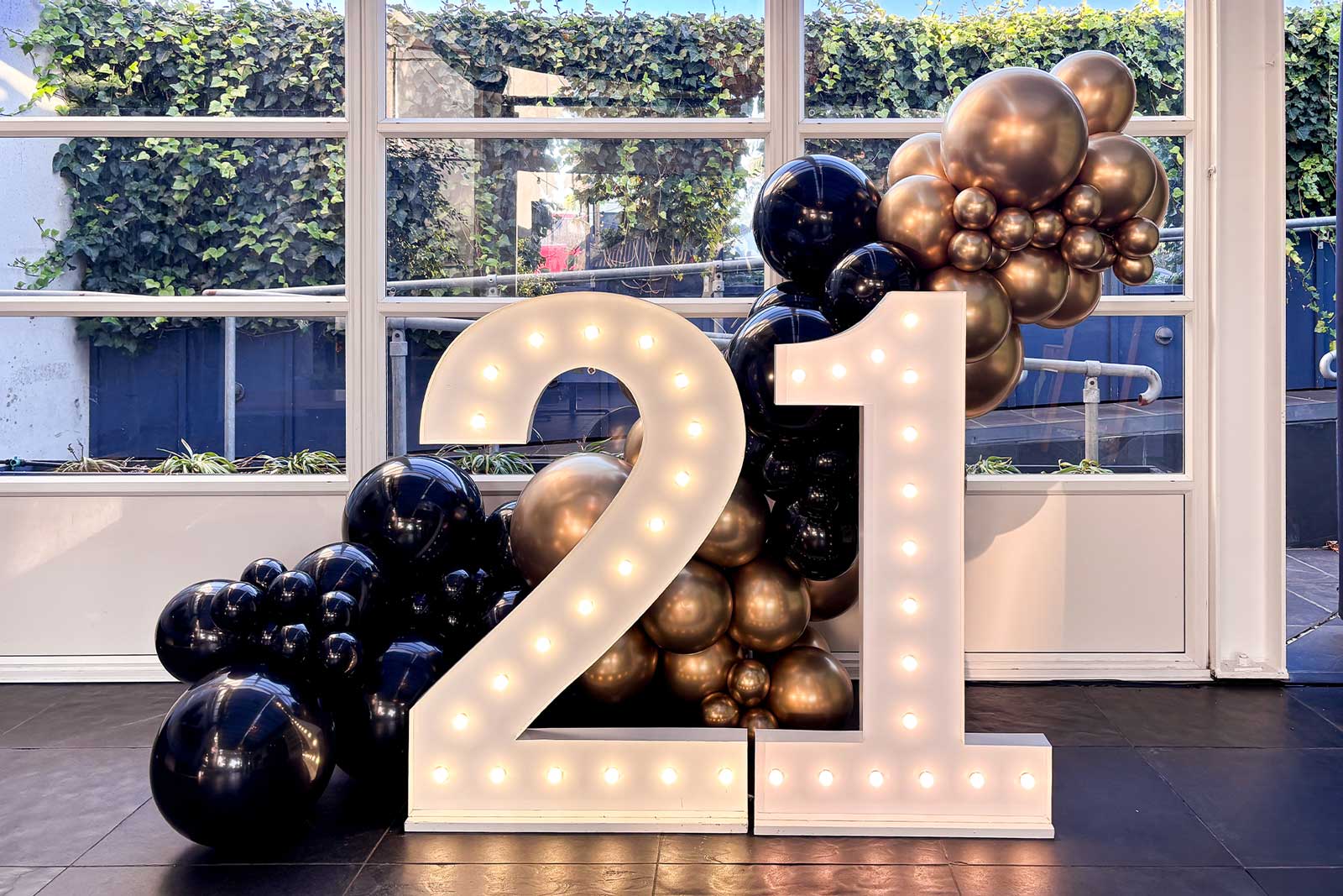 Light up numbers with balloon display for birthday event in Auckland