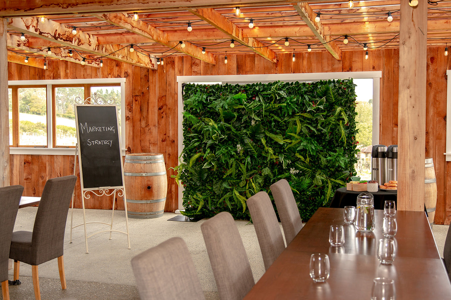 Tropical feature wall with lush green foliage, perfect for photo booths, weddings and special events