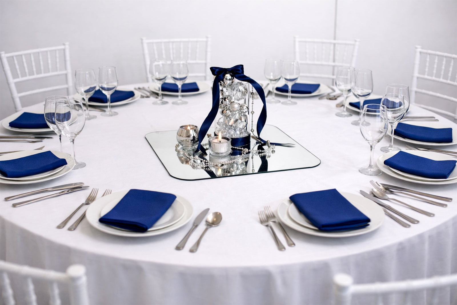 Elegant luxe centrepiece in silver and blue, featuring luxurious decor for gala tables
