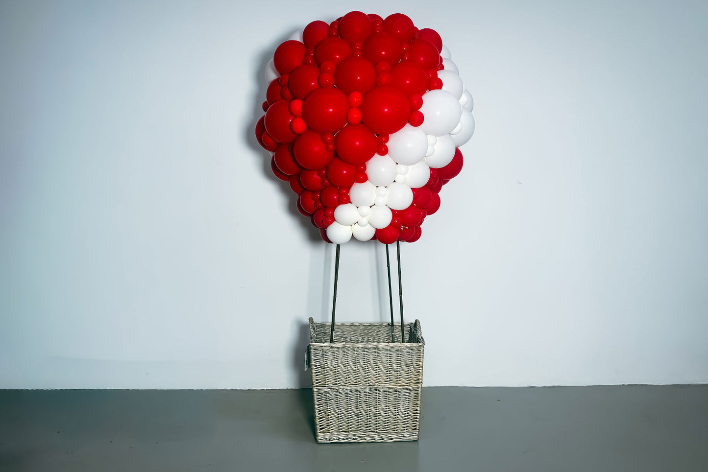 Elegant hot air balloon balloon sculpture featuring pastel balloons for a baby shower or celebration