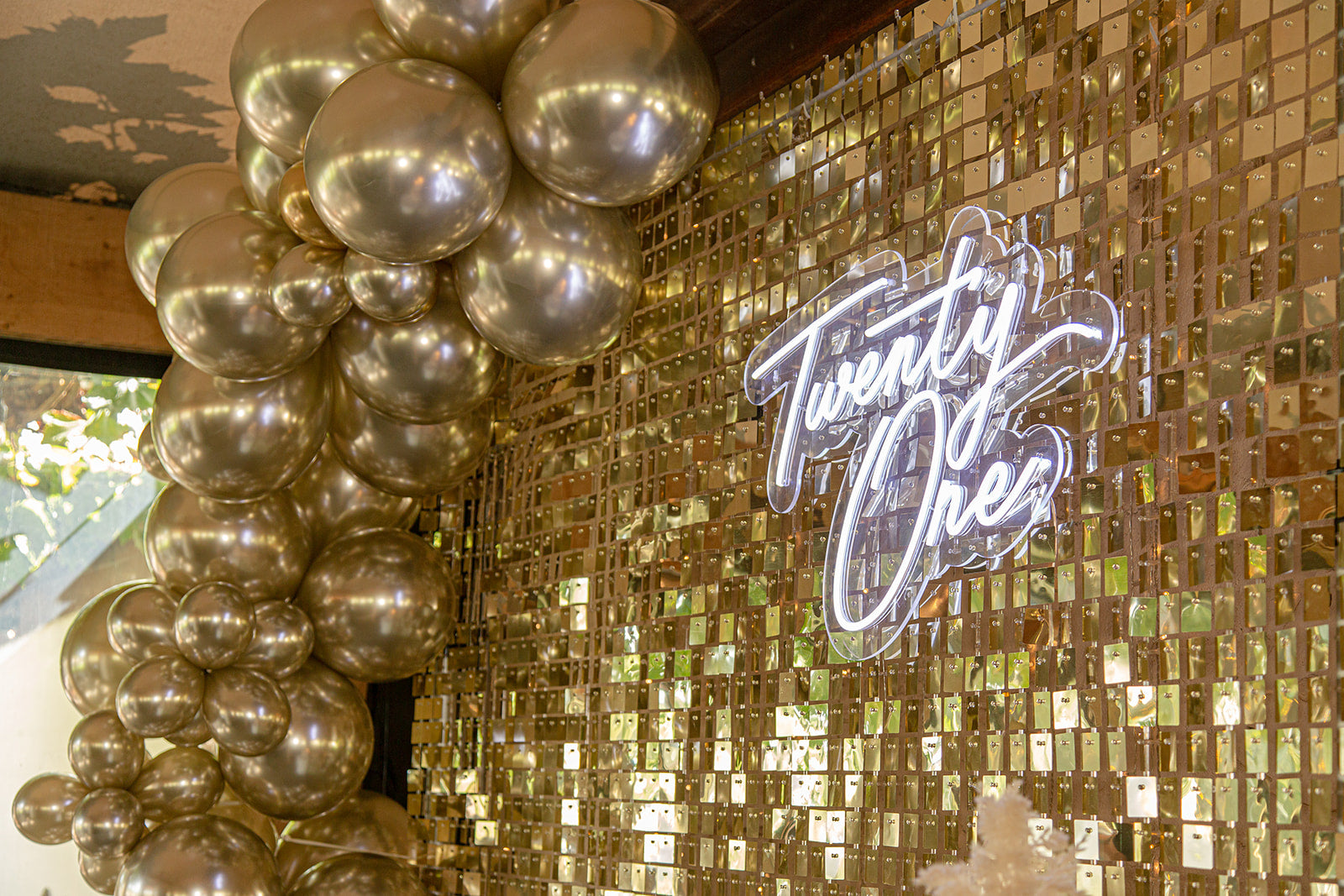 Luxury shimmer wall backdrop with organic balloon garland and custom birthday signage, creating a stunning photo backdrop for celebrations in Auckland, NZ.