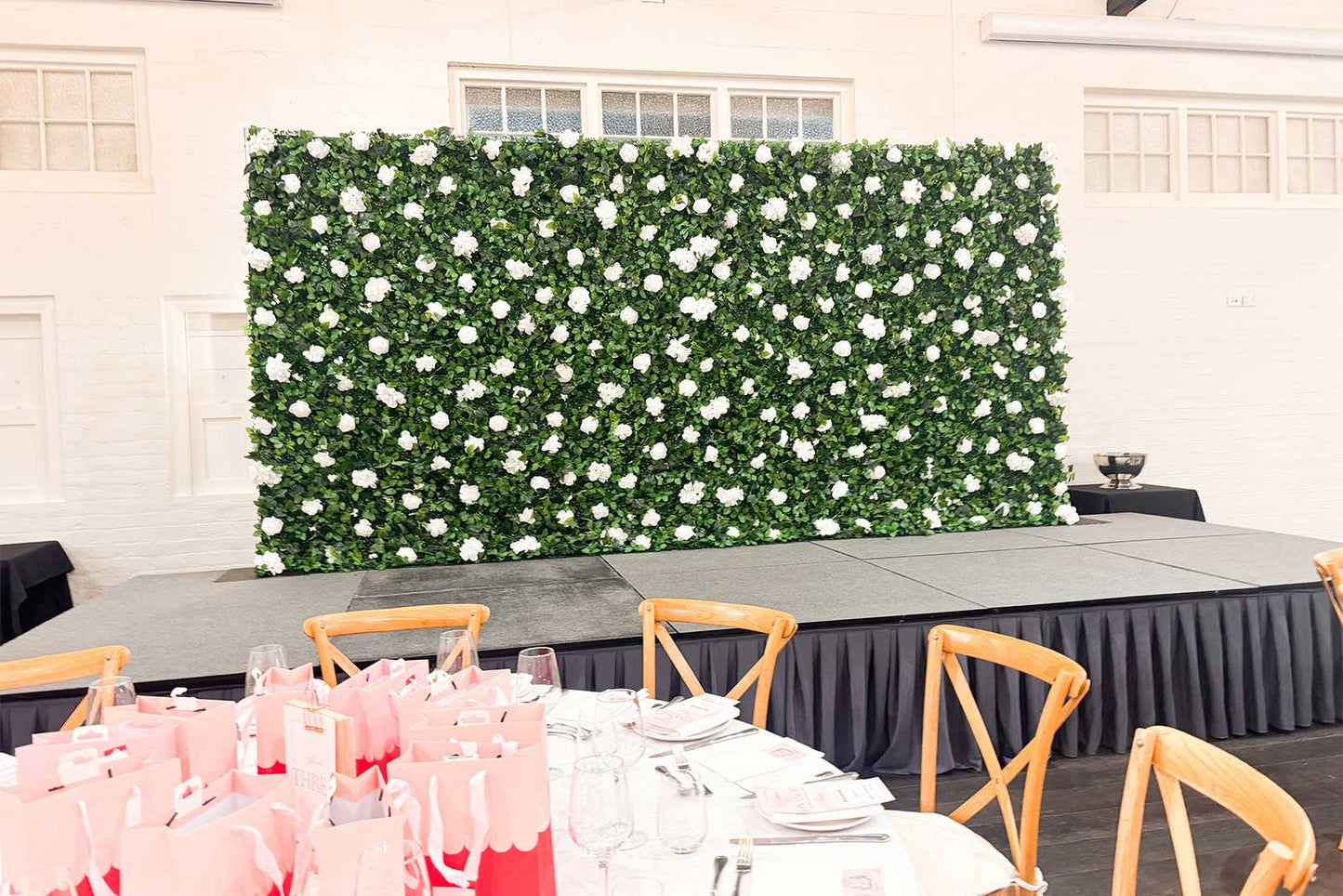 Luxury floral flower wall installed at a New Zealand corporate event, ideal for professional event styling, media walls and guest photography
