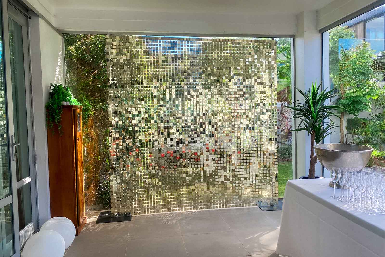 Minimalist shimmer wall backdrop for Auckland corporate celebrations