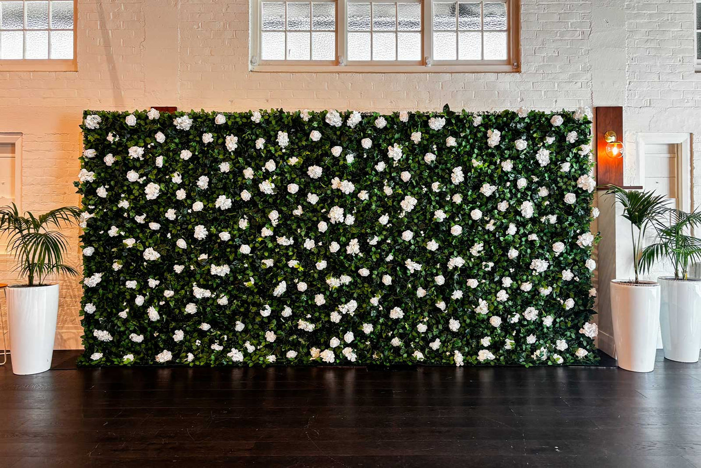 Modern green and white flower wall for corporate meetings and team events