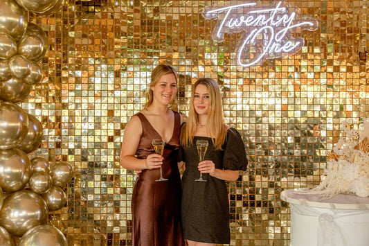 Auckland 21st birthday party featuring neon 21 sign and custom balloon installation