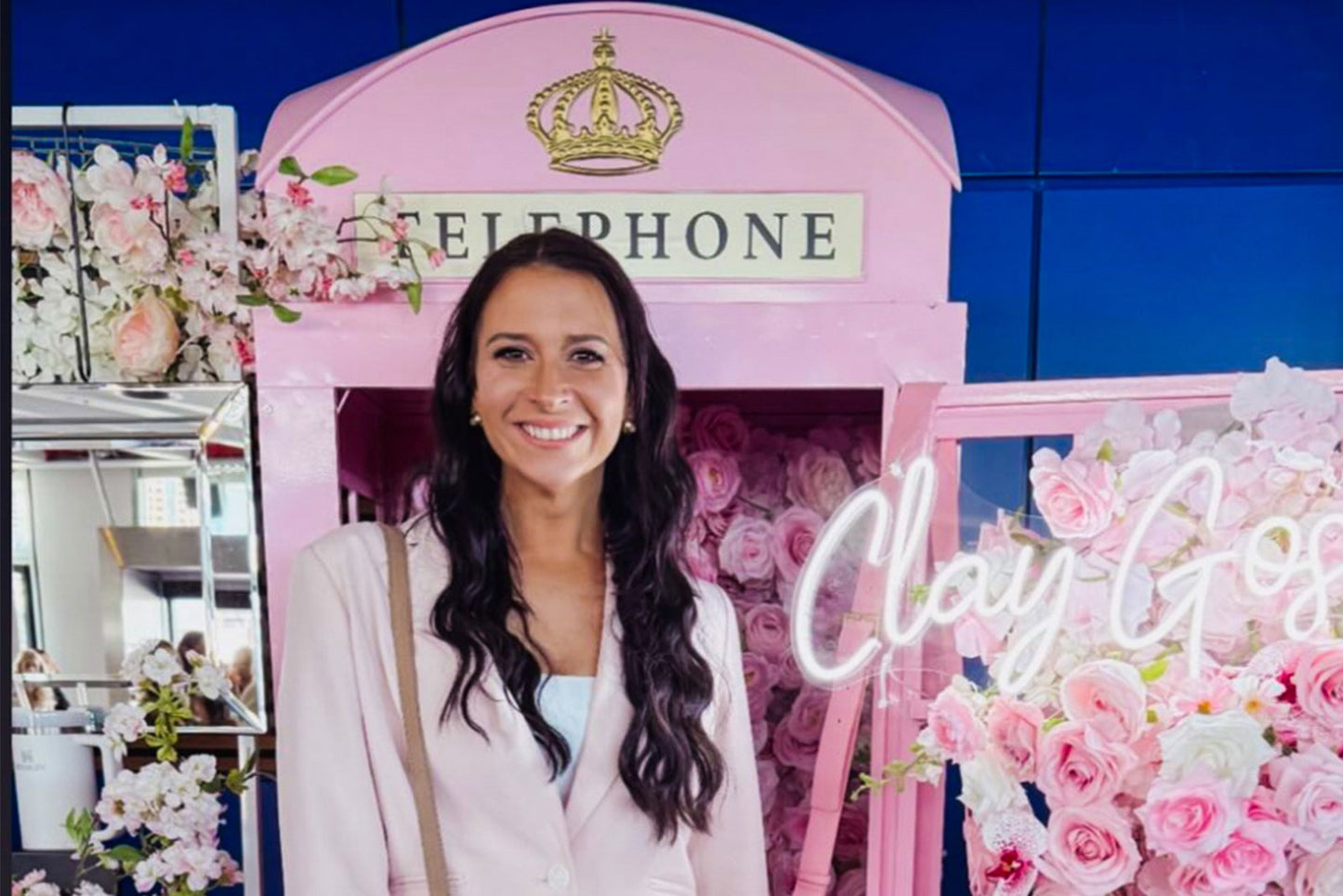 Bright pink phone booth for event décor and photo fun