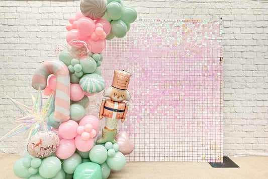 Pink iridescent shimmer wall backdrop reflecting soft rainbow tones for stylish events and photo areas