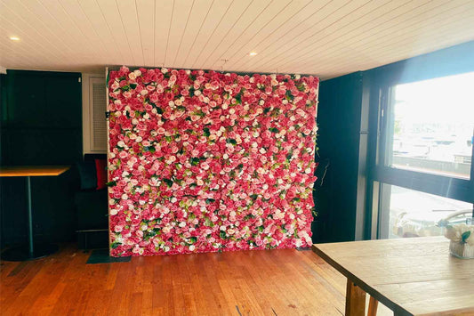 Pink and white flower wall backdrop for milestone birthday parties, baby shower