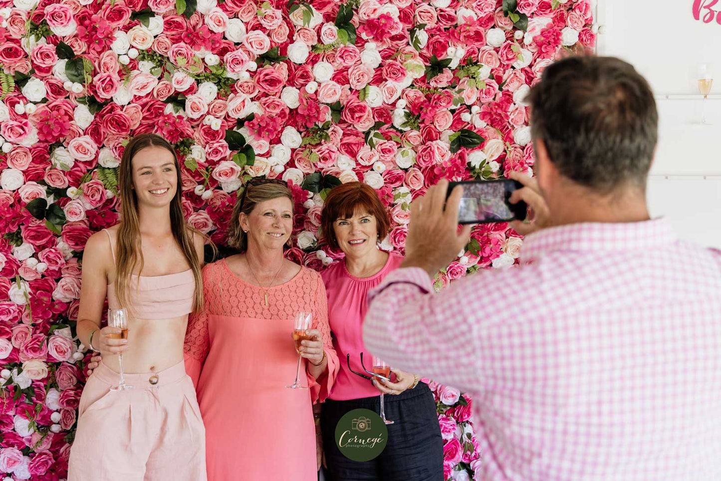 Pink and white flower wall backdrop for corporate networking events