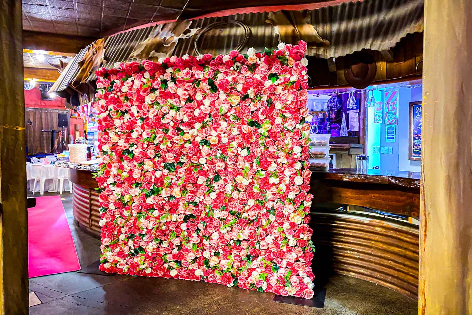 Pink and white flower wall backdrop styled for professional events