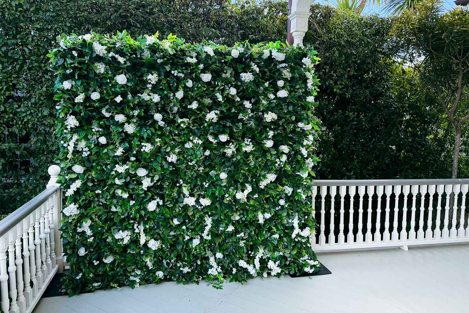 Flower wall backdrop hire for pre-ball photos in Auckland
