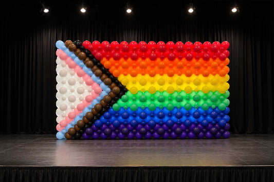 Rainbow Pride balloon flag display with vibrant coloured balloons, perfect for Pride celebrations, community events, festivals, corporate functions, and inclusive event décor across New Zealand.