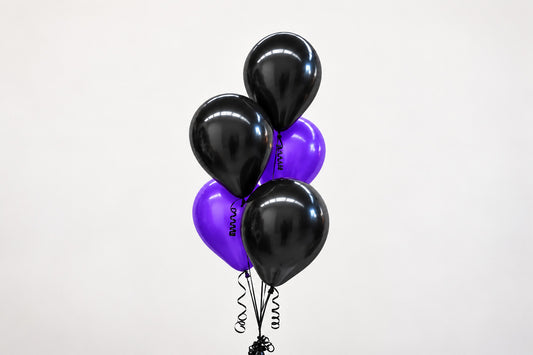 Purple and black helium balloon bunches for Halloween events