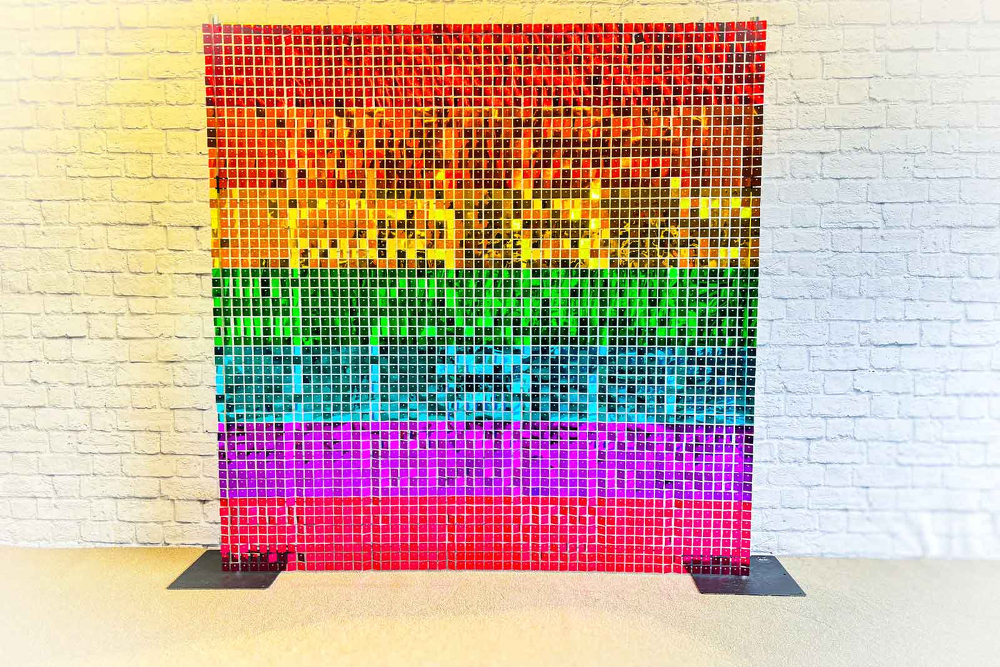 Rainbow shimmer wall backdrop creating a colourful and vibrant photo area for events and celebrations