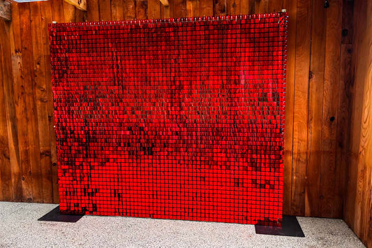 Red shimmer wall backdrop at corporate event in Auckland, 21st