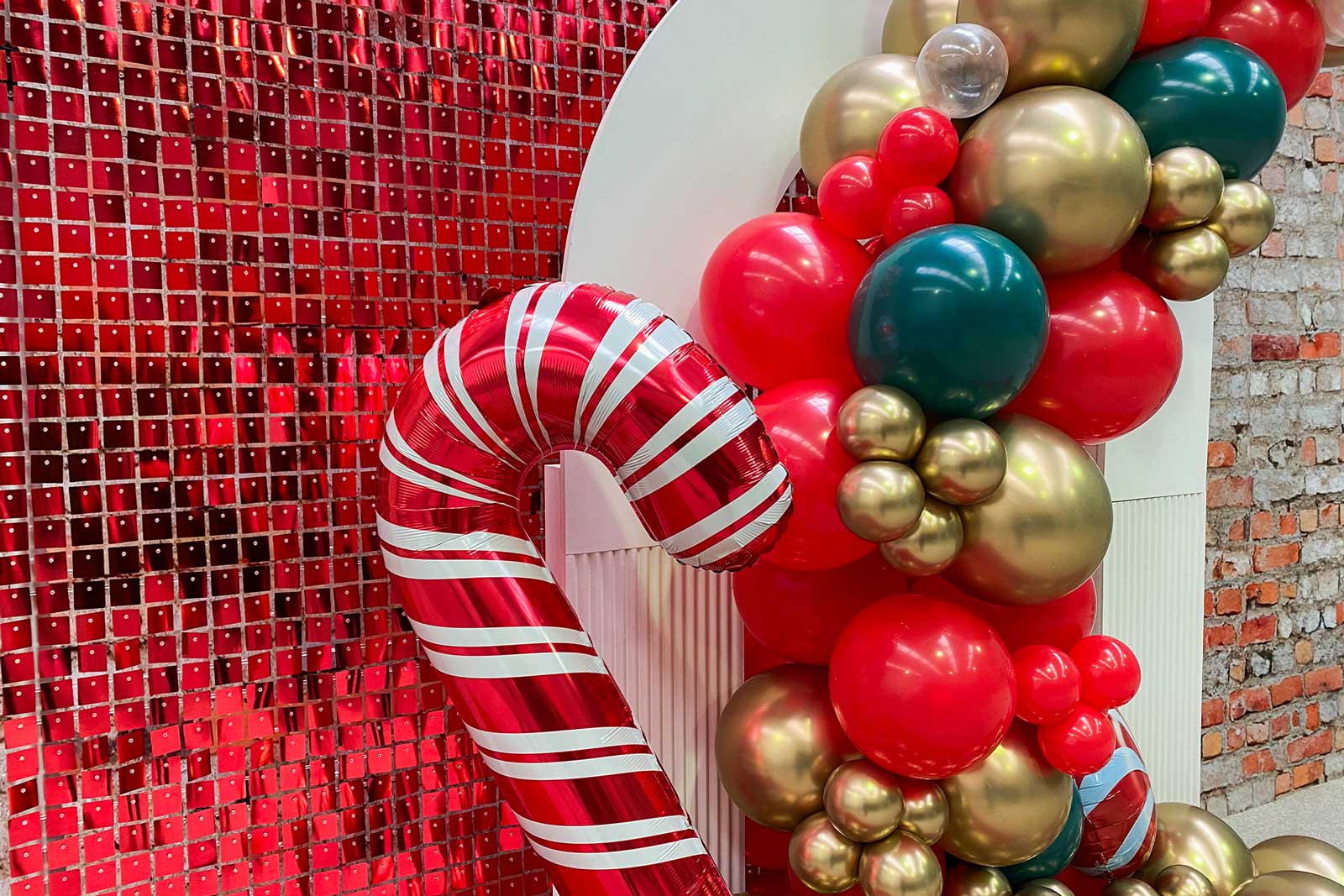 Red shimmer wall backdrop creating a bold and glamorous photo area for events