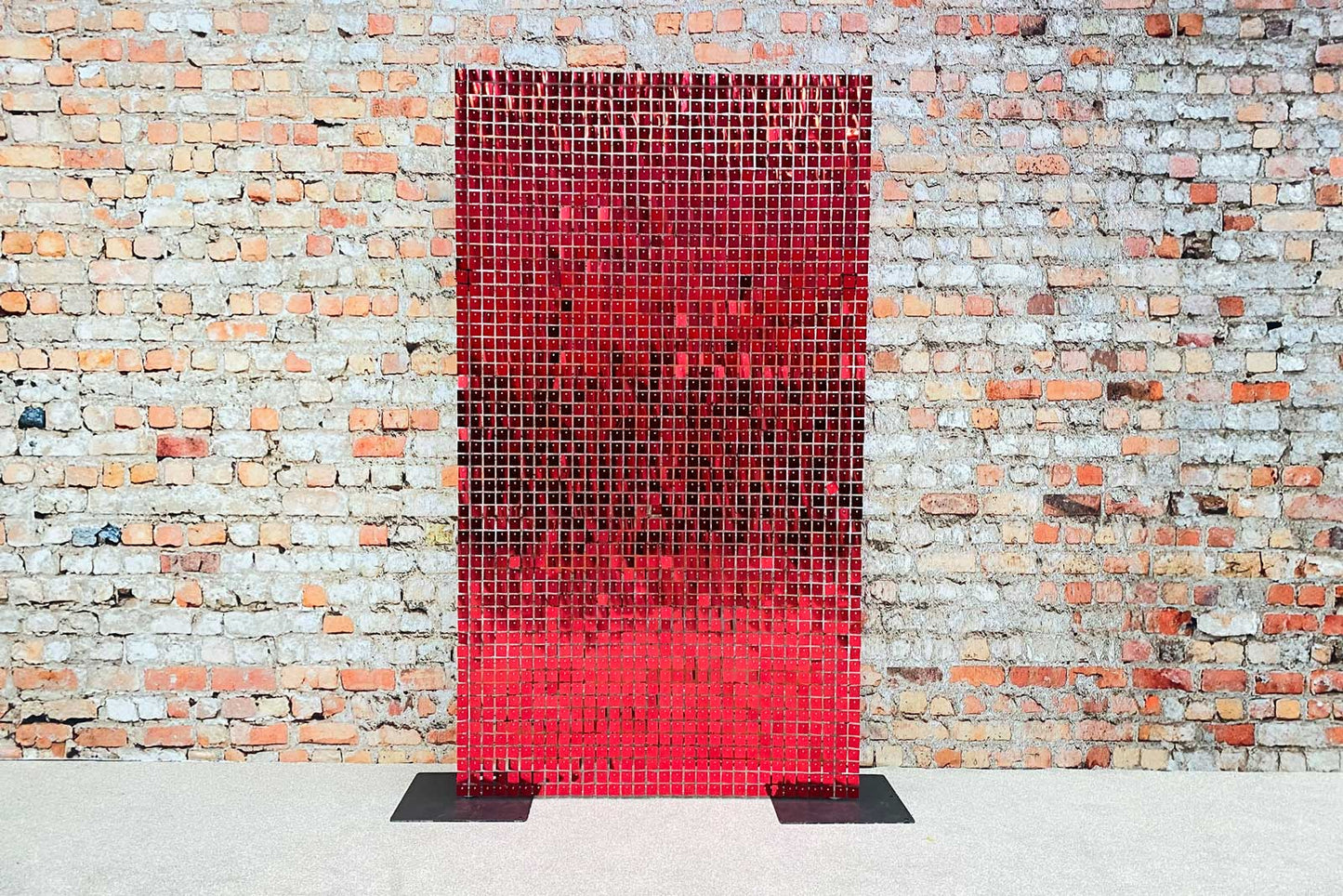 Red shimmer wall backdrop adding a striking feature to parties and themed celebrations