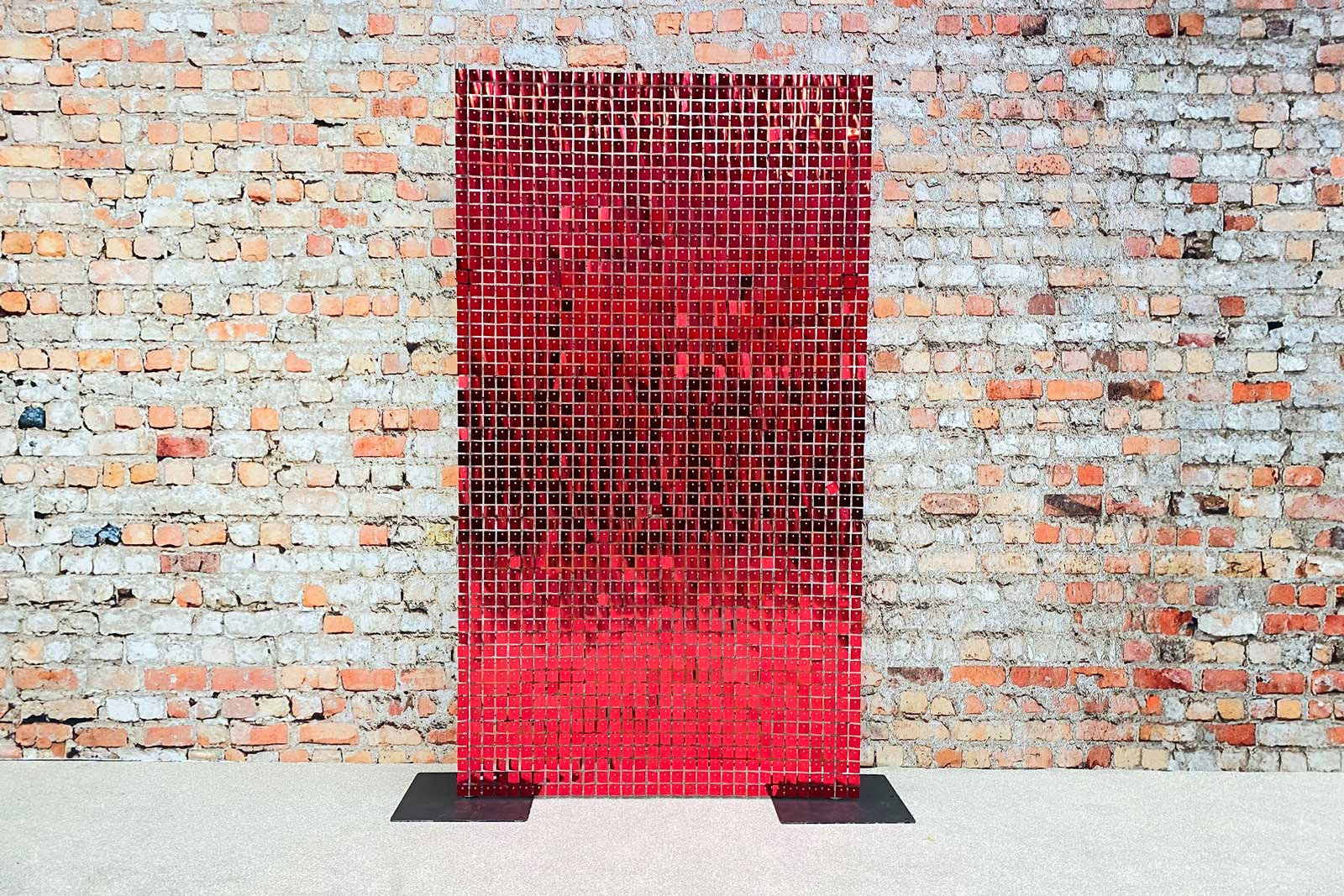 Red shimmer wall backdrop adding a striking feature to parties and themed celebrations