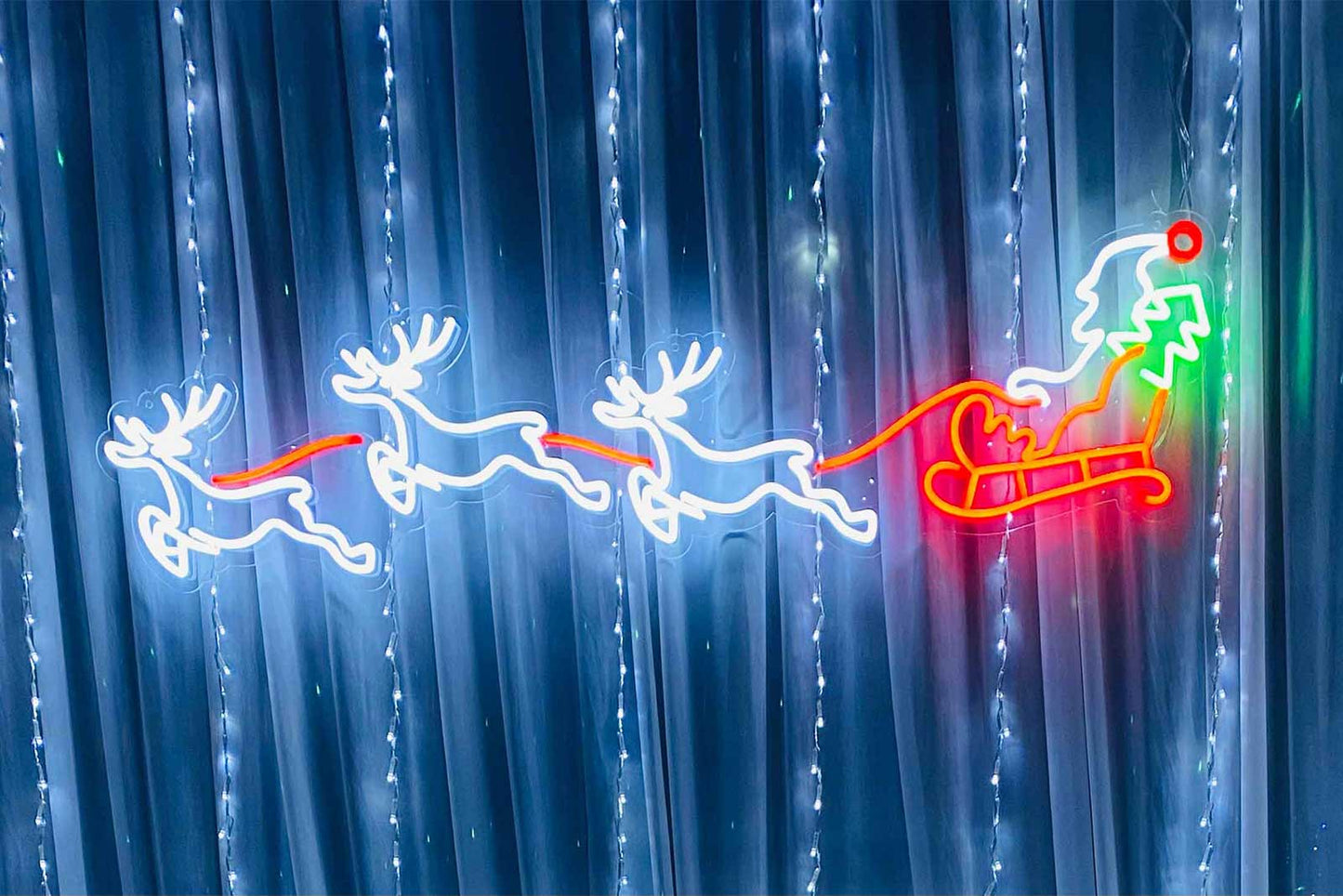 Reindeer and sleigh neon sign hire for Christmas parties, festive events and holiday celebrations in Auckland by Mad Dog Backdrops.