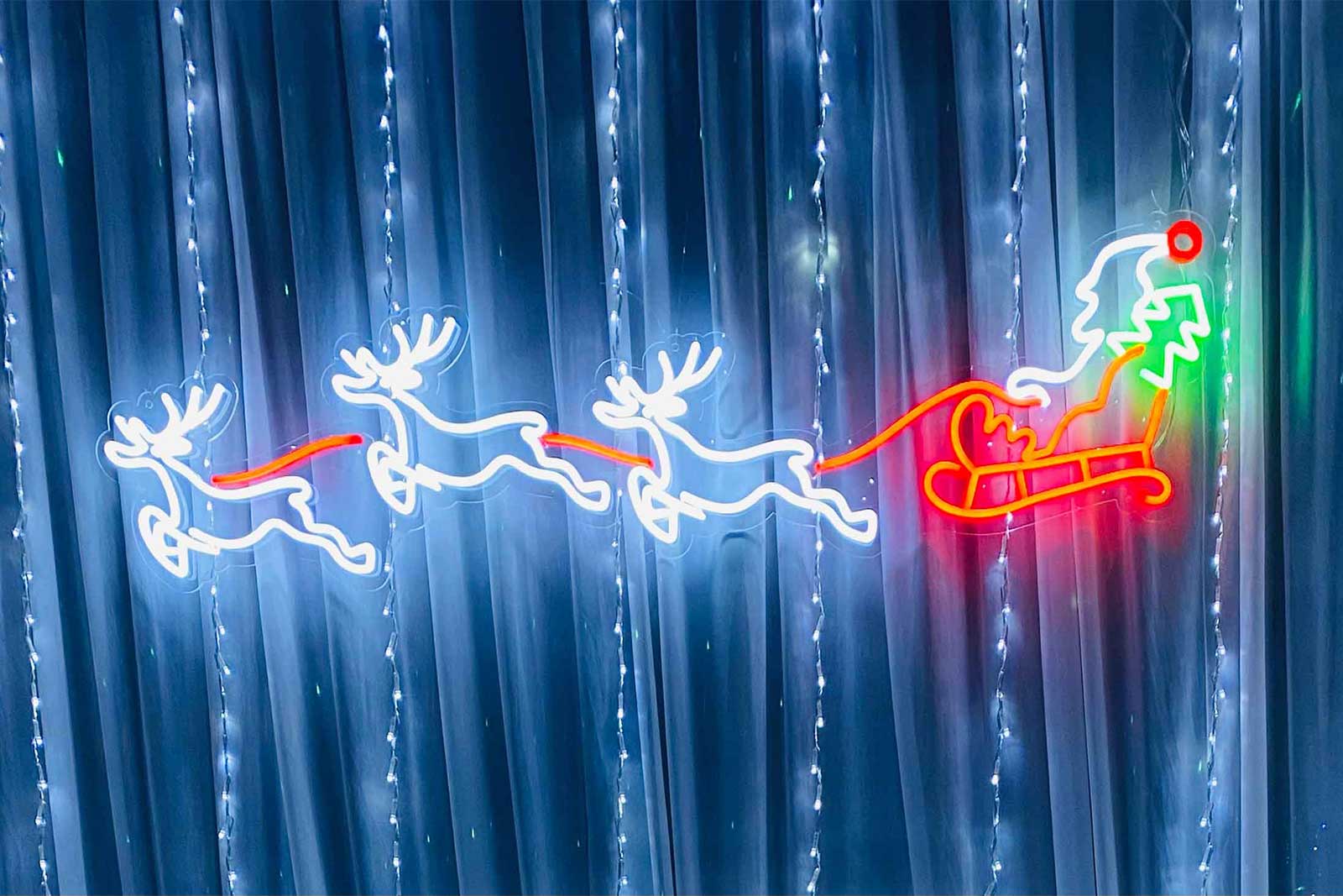 Reindeer and sleigh neon sign hire for Christmas parties, festive events and holiday celebrations in Auckland by Mad Dog Backdrops.