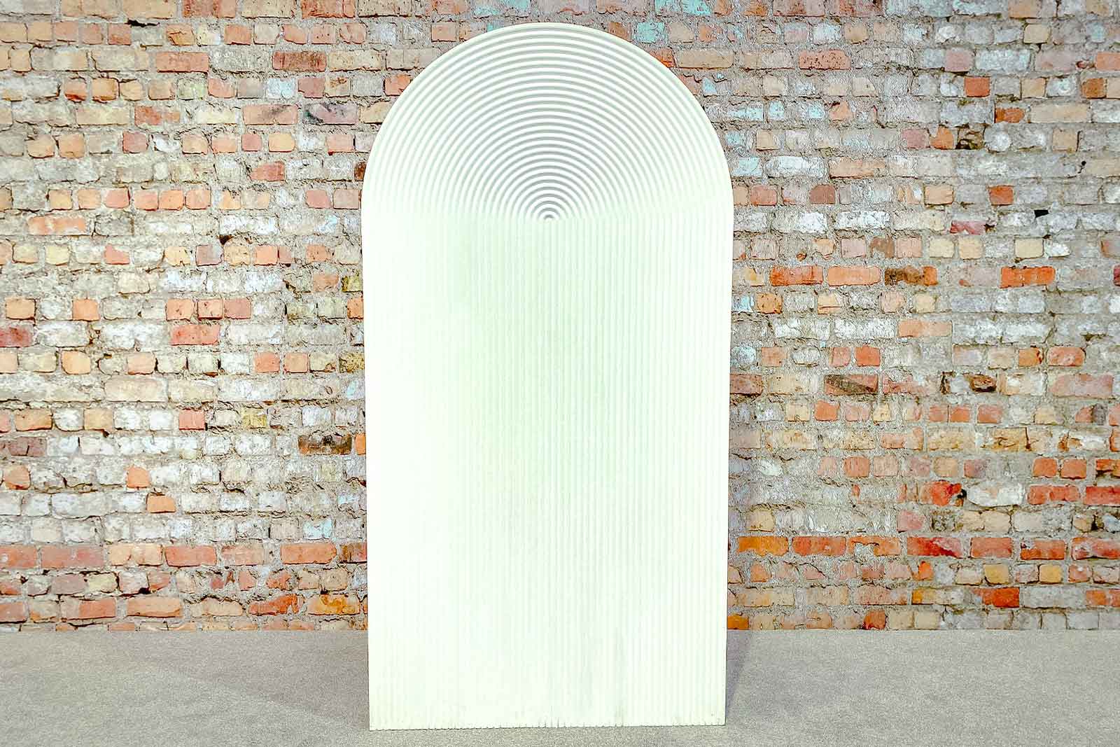 Ribbed arch backdrop creating a modern and stylish photo area for parties and celebrations