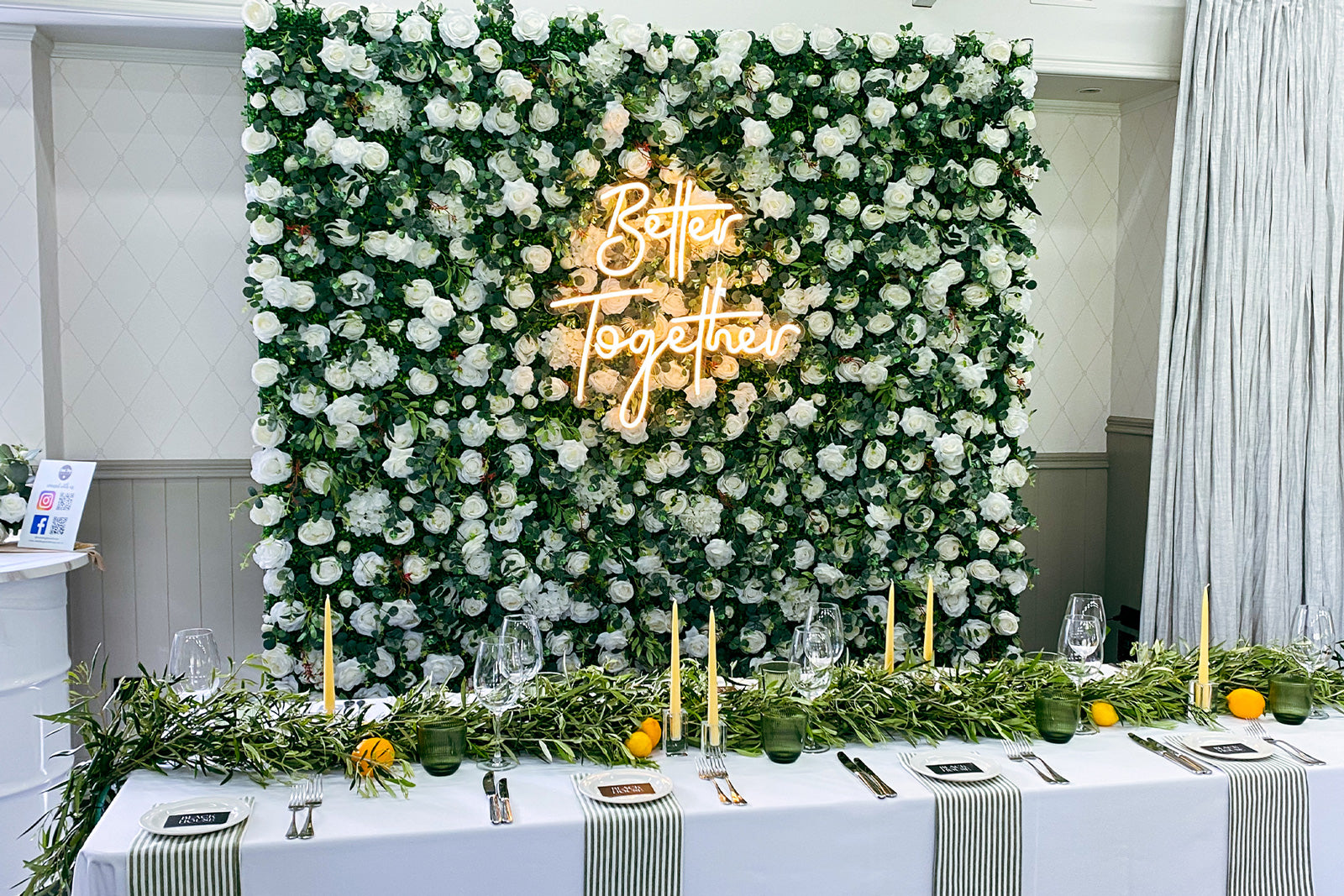 Romantic wedding flower wall with glowing "Better Together" neon sign for elegant photo backdrops