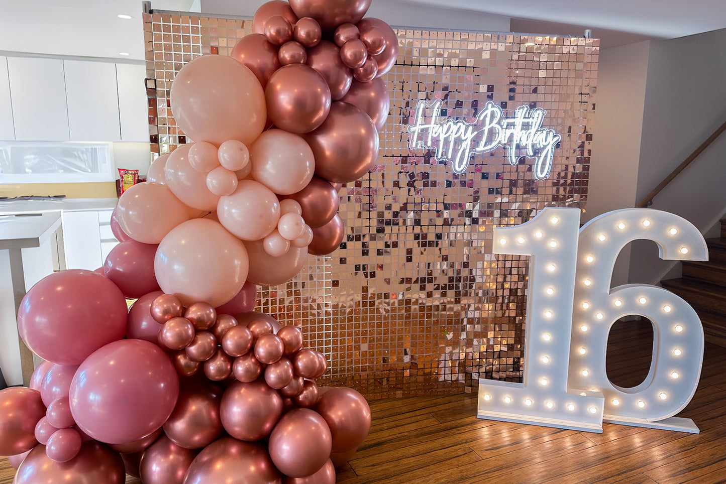 Rose gold shimmer wall hire adding glamour and sparkle to birthday celebrations
