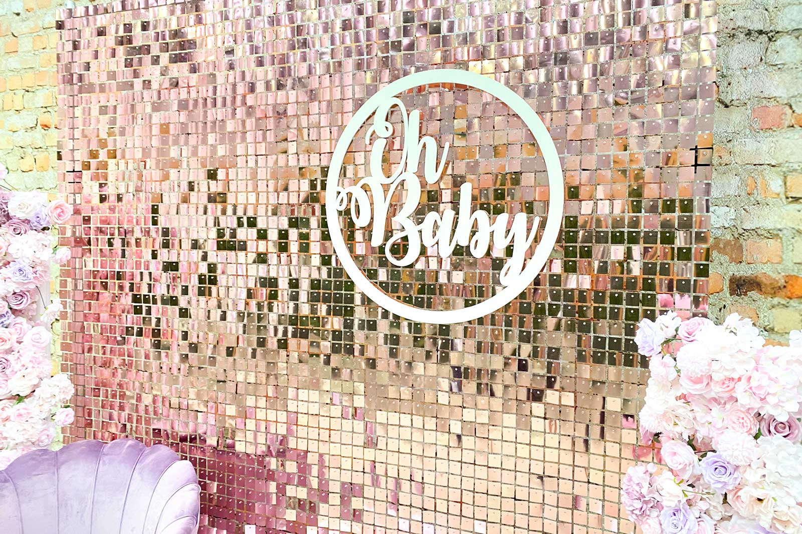Rose pink shimmer wall backdrop creating a soft and elegant photo area for baby showers