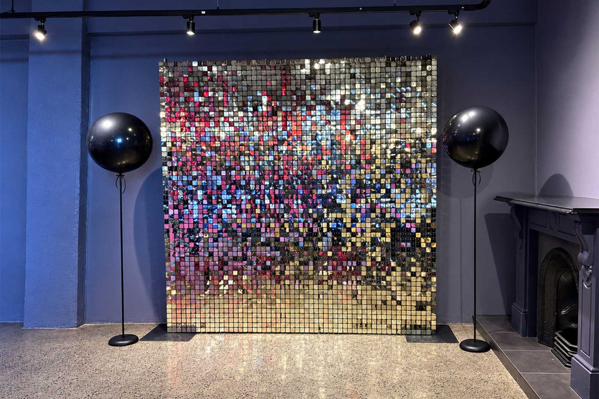 Shimmer wall backdrop with jumbo balloons for an elegant event decoration