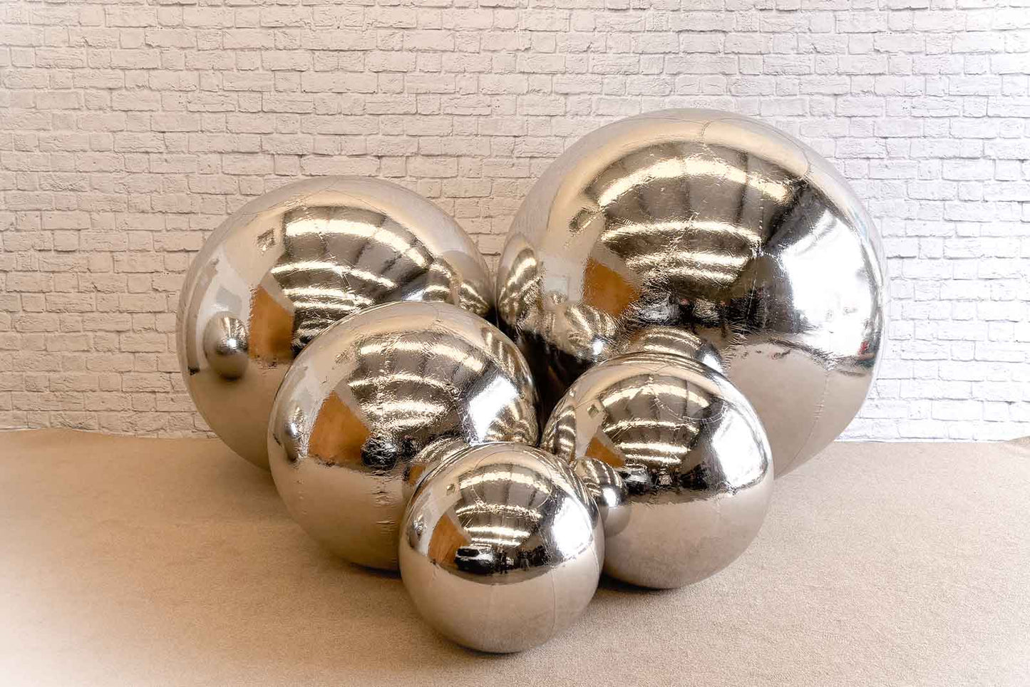 Shiny silver inflatable balls for photo displays and décor"