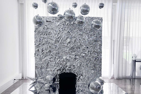 Silver crinkle foil wall backdrop for corporate event branding and photo activation