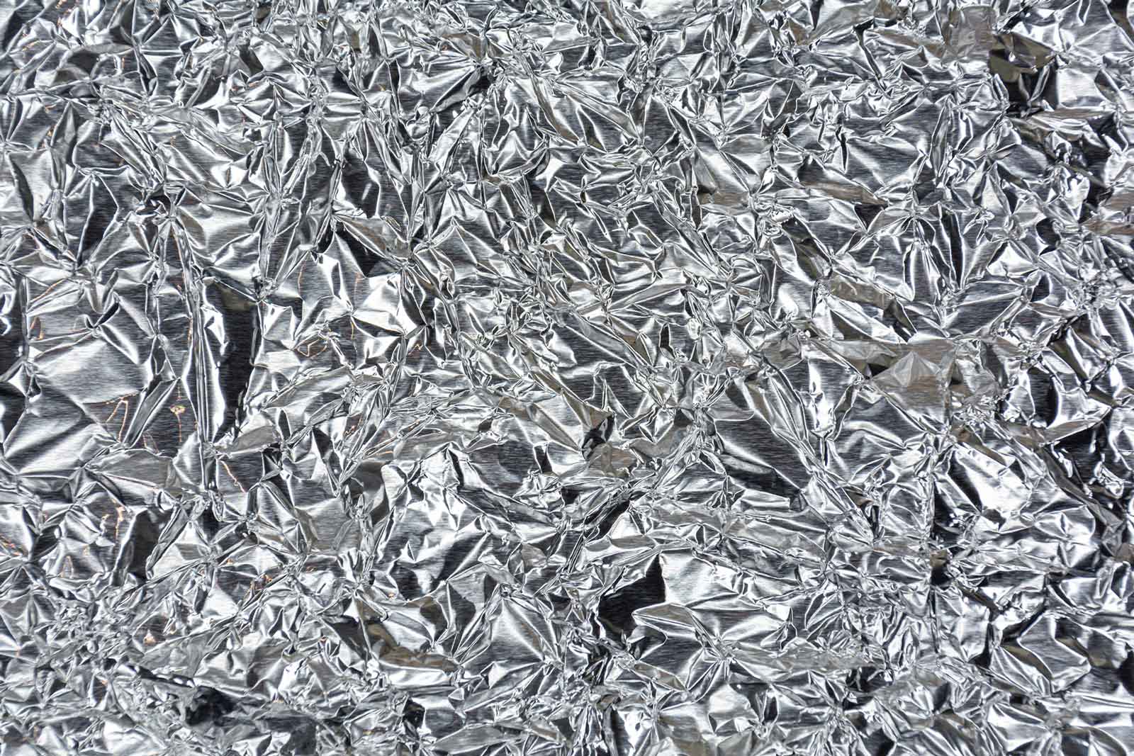 Metallic silver crinkle foil wall for corporate launches and professional events